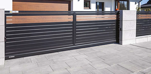 Cantilever sliding gates are supported by rollers attached to a counterbalance frame, allowing the gate to slide horizontally without the need for a track along the ground. These gates are ideal for uneven terrain or locations where ground track installation is not feasible.